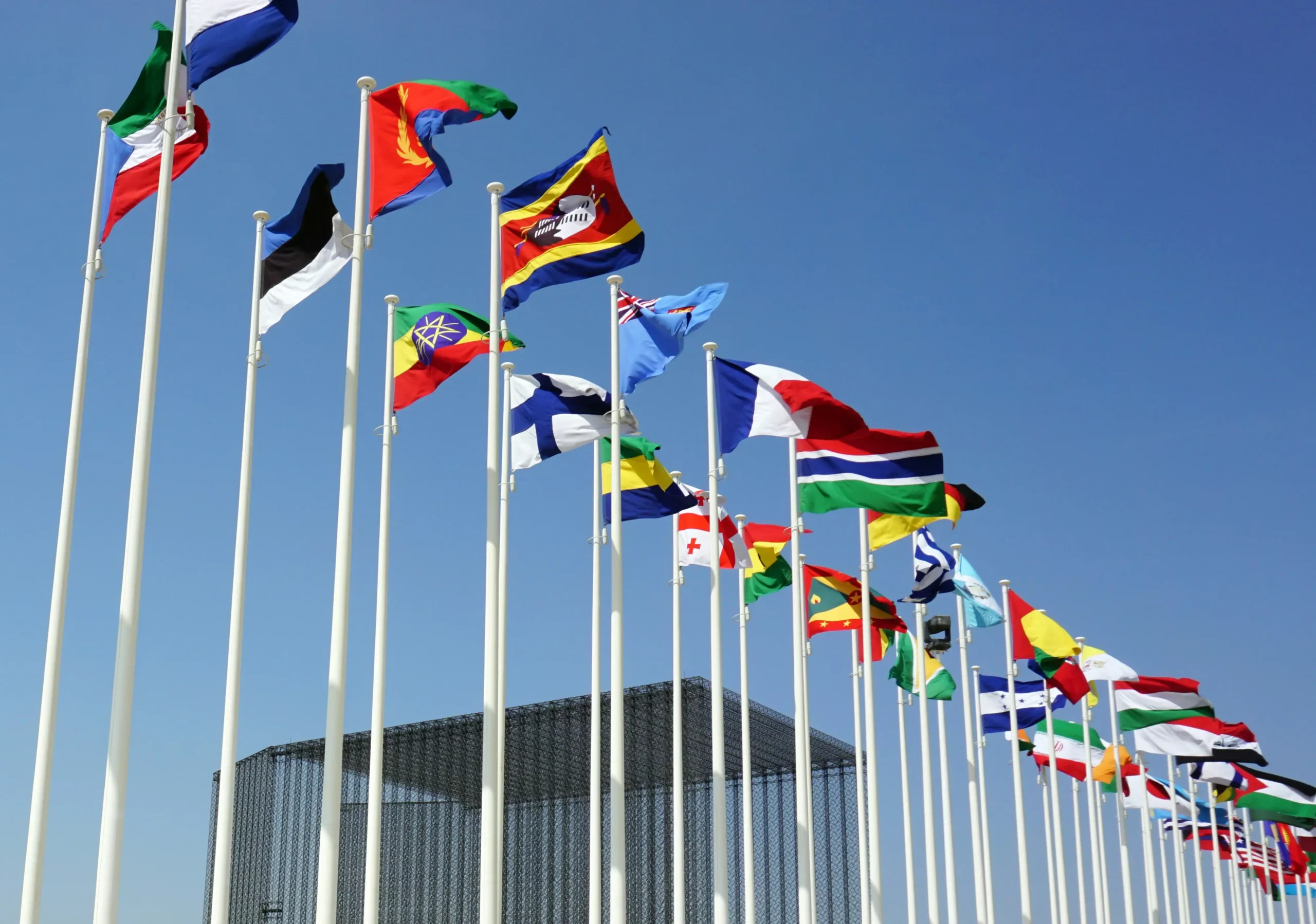 Many flags representing different nations and cultures with unity